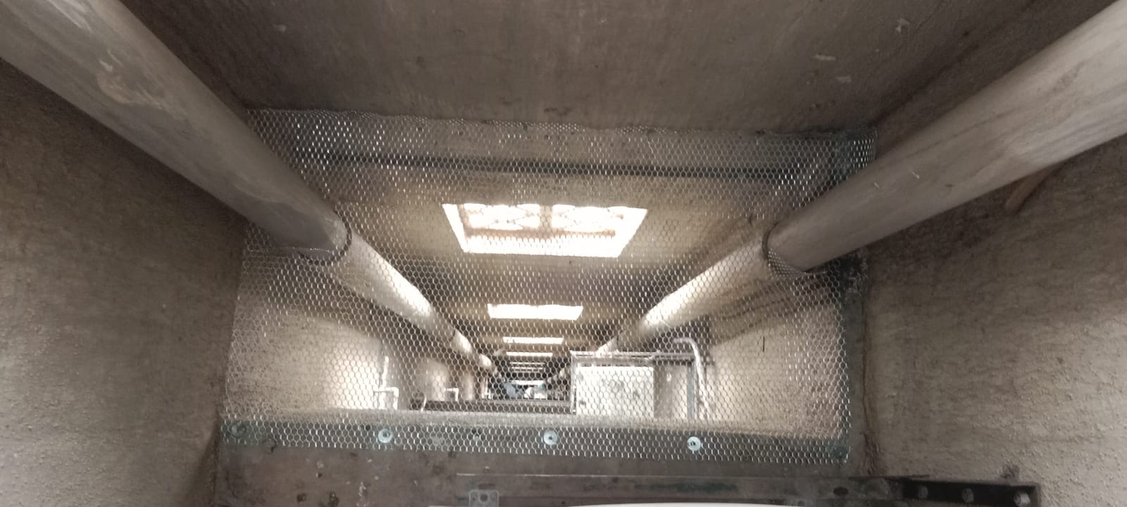 Aluminium mesh net fitted inside a service shaft